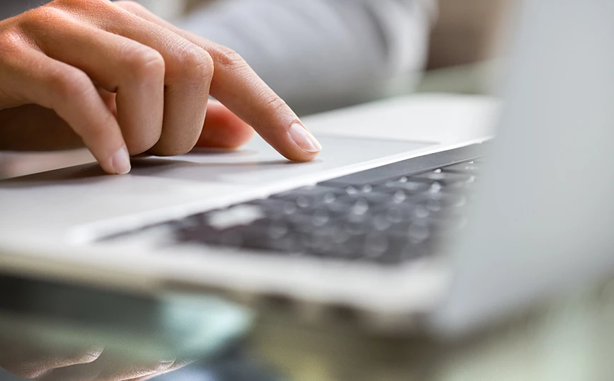 Hand Tuoching Apple Computer